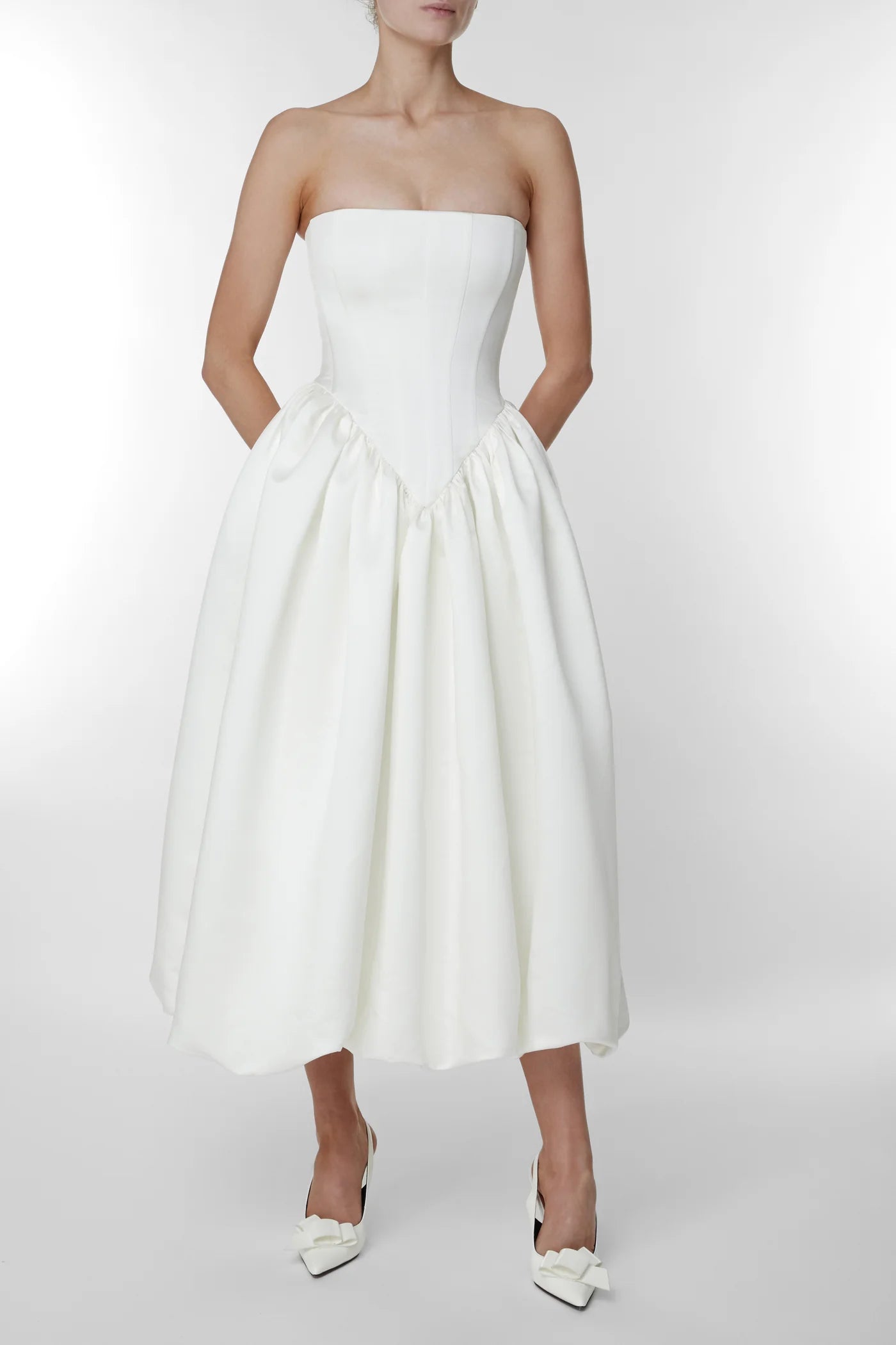Upgrade your style with the versatile and feminine Maddison Dress. From the ceremony to the after-party, this strapless design effortlessly adapts to your desired look. Elevate your wedding attire with the perfect choice: the Eva Dress, your go-to for both beauty and functionality.