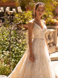 Unleash your inner goddess with the Robe Crystal, a luxury bridal gown adorned with dazzling crystal accents. Its soft and flowing long sleeves and striking mermaid silhouette will have you feeling beautiful and graceful as you make your grand entrance. Elevate your special day with this stunning and elegant robe.