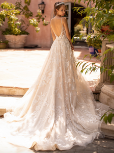 Unleash your inner goddess with the Robe Crystal, a luxury bridal gown adorned with dazzling crystal accents. Its soft and flowing long sleeves and striking mermaid silhouette will have you feeling beautiful and graceful as you make your grand entrance. Elevate your special day with this stunning and elegant robe.