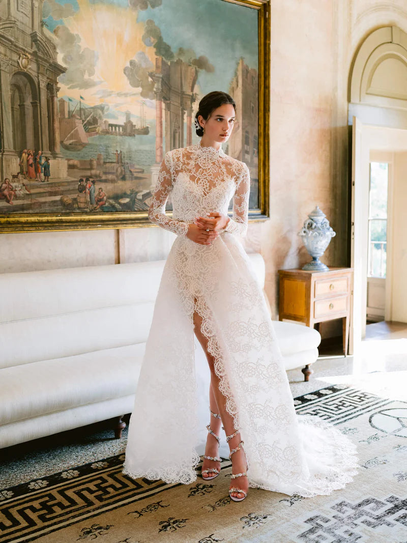 Experience the opulent Melrose Gown, a stunning garment crafted from premium lace and mesh. Its lace details and form-fitting bodice create a striking silhouette, while the voluminous skirt offers versatility for elegant and refined ensembles. In elegant ivory, this minimalistic design epitomizes exclusivity and sophistication.