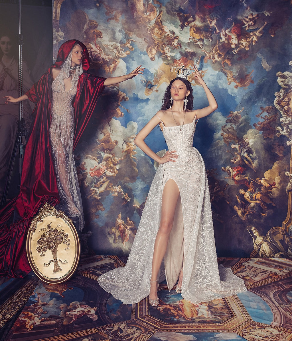 Indulge in luxury with the Elizabeth Gown. Exquisite and hand-crafted, this dress features a corseted bodysuit adorned with intricate appliqué and delicate lace overlay. The voluminous silk taffeta skirt adds a touch of drama, making it the perfect choice for your special occasions. Elevate your style and make a statement with this exclusive and elegant gown.