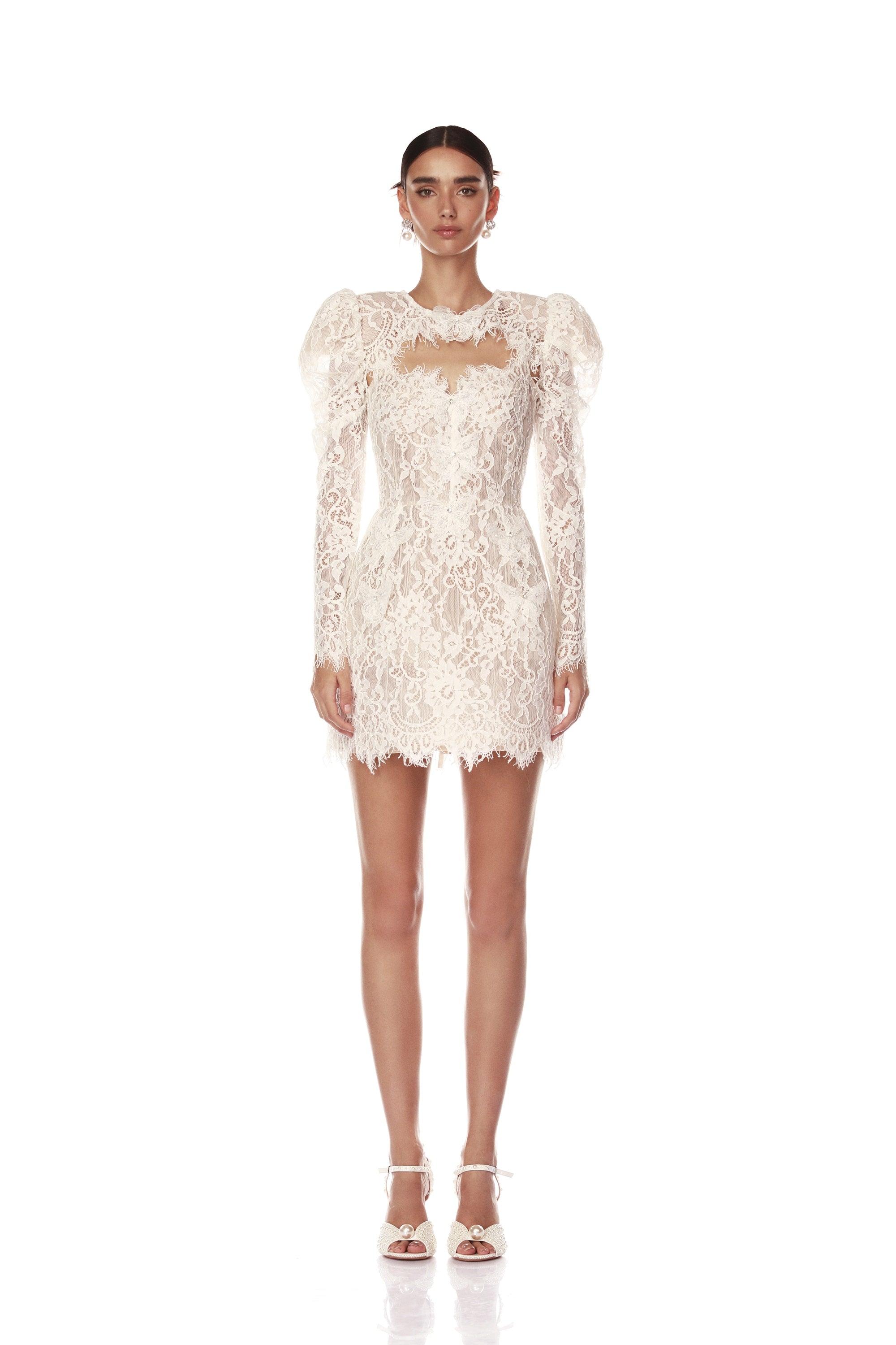 Elevate your bridal look with the Colette Lace Mini Dress. The sweetheart neckline and butterfly embellishments exude feminine grace, while the boned bodice and structured skirt provide a flattering silhouette. The hidden adjustable straps ensure a comfortable fit, making this dress perfect for your special day.