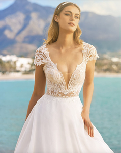 Look amazing for your special event in the chic and elegant Lucienne Gown. Its timeless formal occasion design is perfect for weddings, parties or evenings out, and will make sure you stand out from the crowd. Enjoy the sweet details of this beautiful dress and show off your best features in style.