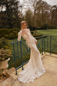 Looking for a stunning wedding dress? Look no further than our Aidy Gown! This beautifully crafted gown features delicate lace and a figure-flattering mermaid silhouette. With long sleeves and a bespoke fit, you'll feel confident and radiant on your special day. Say "I do" in style with this gorgeous dress.