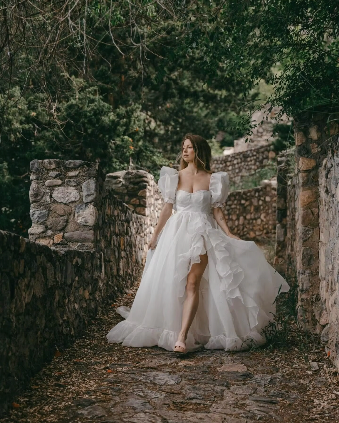 The Danielle Dress is everything you could dream of in a fantasy bridal gown. Enchanting, chic, and romantic, it will make you feel like a princess on your special day. The flowy design adds a touch of elegance, making it the perfect choice for a fairytale wedding. Say "I do" to the dress of your dreams.