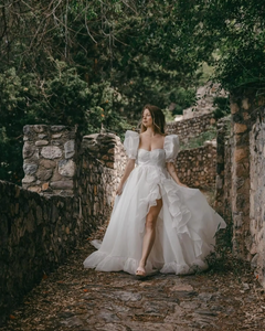 The Danielle Dress is everything you could dream of in a fantasy bridal gown. Enchanting, chic, and romantic, it will make you feel like a princess on your special day. The flowy design adds a touch of elegance, making it the perfect choice for a fairytale wedding. Say "I do" to the dress of your dreams.