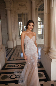 Take a chance with the Alber Dress! This stunning dress is adorned with beautiful crystals, making it the perfect choice for a unique bridal look. Embrace your adventurous side on your special day with this amazing piece.