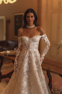 Discover the enchanting elegance of our Amira Gown, inspired by modern fairytales. Crafted with luxurious lace, this ballgown highlights your beauty and brings a touch of timeless grace to any special occasion. Make a statement with this stunning gown.