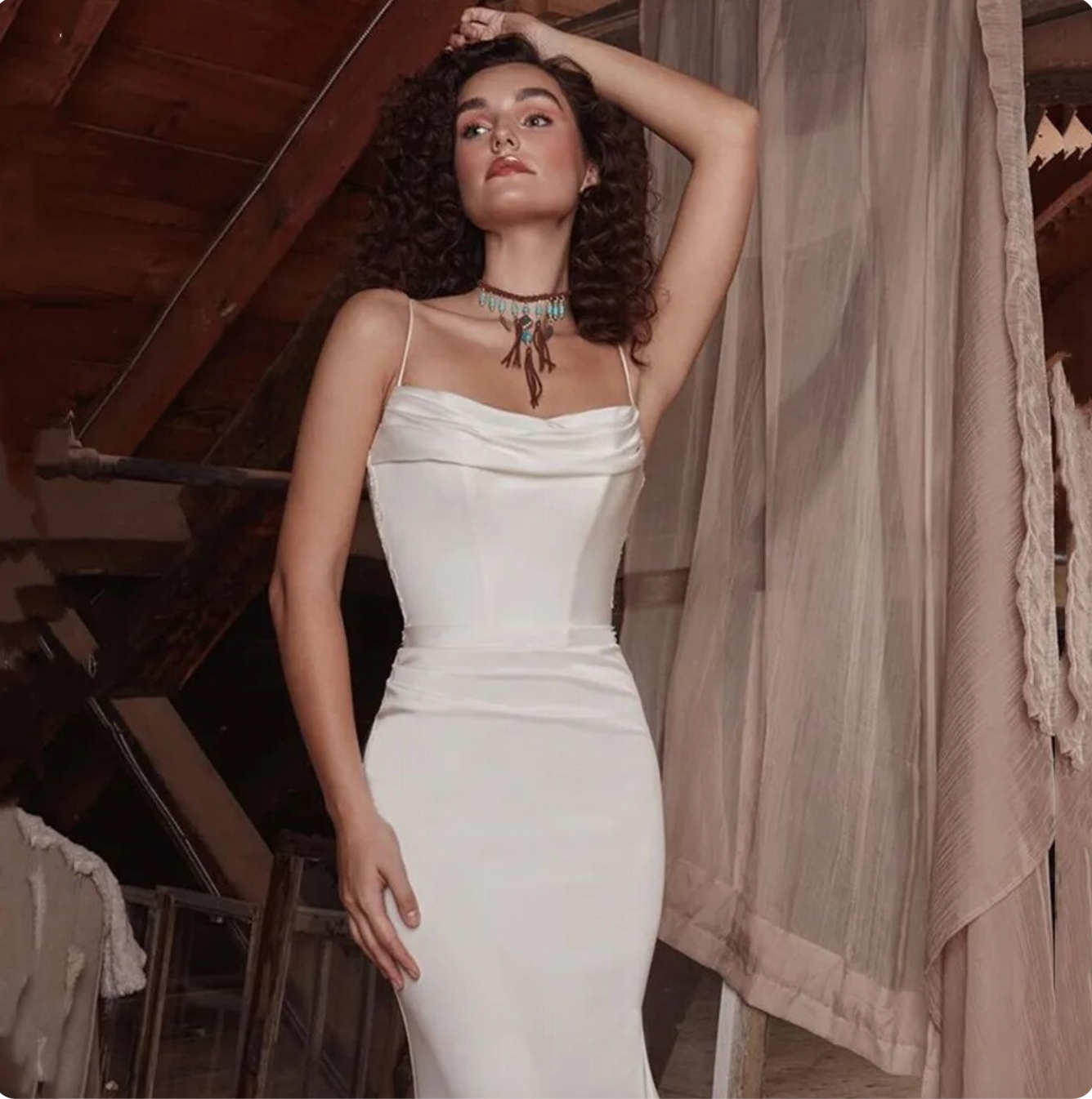 Elegant, sophisticated, and undeniably alluring, the Robe Sarita is the perfect wedding dress for the modern bride. With its strapless design, delicate lace appliques, and flattering mermaid silhouette, it exudes a sense of romance and grace. Whether you're walking down the aisle or dancing the night away, this gown will make you feel like the most beautiful bride.