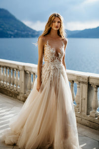 Create magical memories in the Antonella Dress. This sophisticated gown ensures your special day is filled with tenderness and everlasting beauty. Let its timeless design captivate you as you gracefully glide down the aisle!