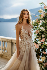Create magical memories in the Antonella Dress. This sophisticated gown ensures your special day is filled with tenderness and everlasting beauty. Let its timeless design captivate you as you gracefully glide down the aisle!