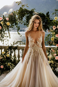 Create magical memories in the Antonella Dress. This sophisticated gown ensures your special day is filled with tenderness and everlasting beauty. Let its timeless design captivate you as you gracefully glide down the aisle!