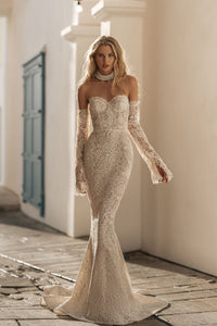 Elevate your wedding look to the next level with the Robe Luciane. Crafted from delicate fabric and featuring embroidered lace, princess pearls, and a timeless silhouette, this white wedding gown is sure to be a show-stopper! Slip it on and get ready to say "I do!" in style!