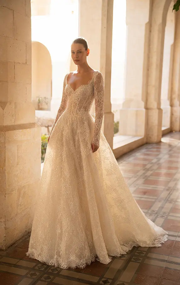 Indulge in the ultimate luxury with our Robe Mavi - a princess gown fit for royalty. Crafted from luxurious lace and adorned with delicate sequins, this elegant gown boasts a long train and long sleeves for a regal look. Stand out and shine with a touch of sparkle.