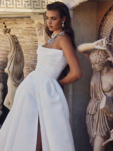 Infuse your big day with allure in the Marielle Gown. This exquisite, romantic wedding dress features a simple, yet beautiful design that will make you feel like a French beauty. Perfect for both bridal and evening events.