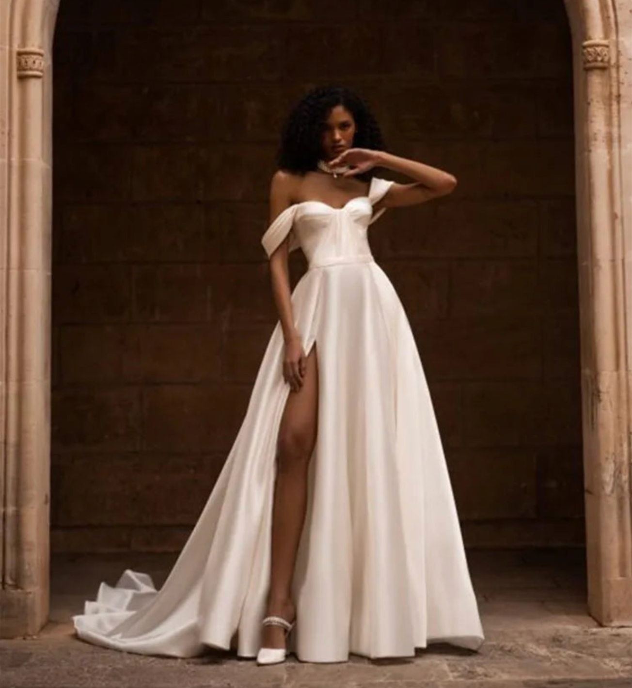 Indulge in luxury with our Robe Ivette. Made from smooth satin, this off-shoulder wedding dress exudes elegance and charm. Its simple design and lightweight material make it perfect for a beach wedding. Complete your bridal look with our exclusive Robe Ivette and feel like a true bride on your special day.