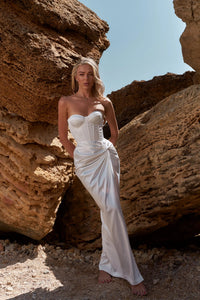 Elevate your special occasion with the Olympia Satin Dress. Made from luxurious satin, this dress features a high slit design for a touch of glamour. Whether for your wedding, prom, or any formal event, this open leg mermaid silhouette dress will surely make you stand out.