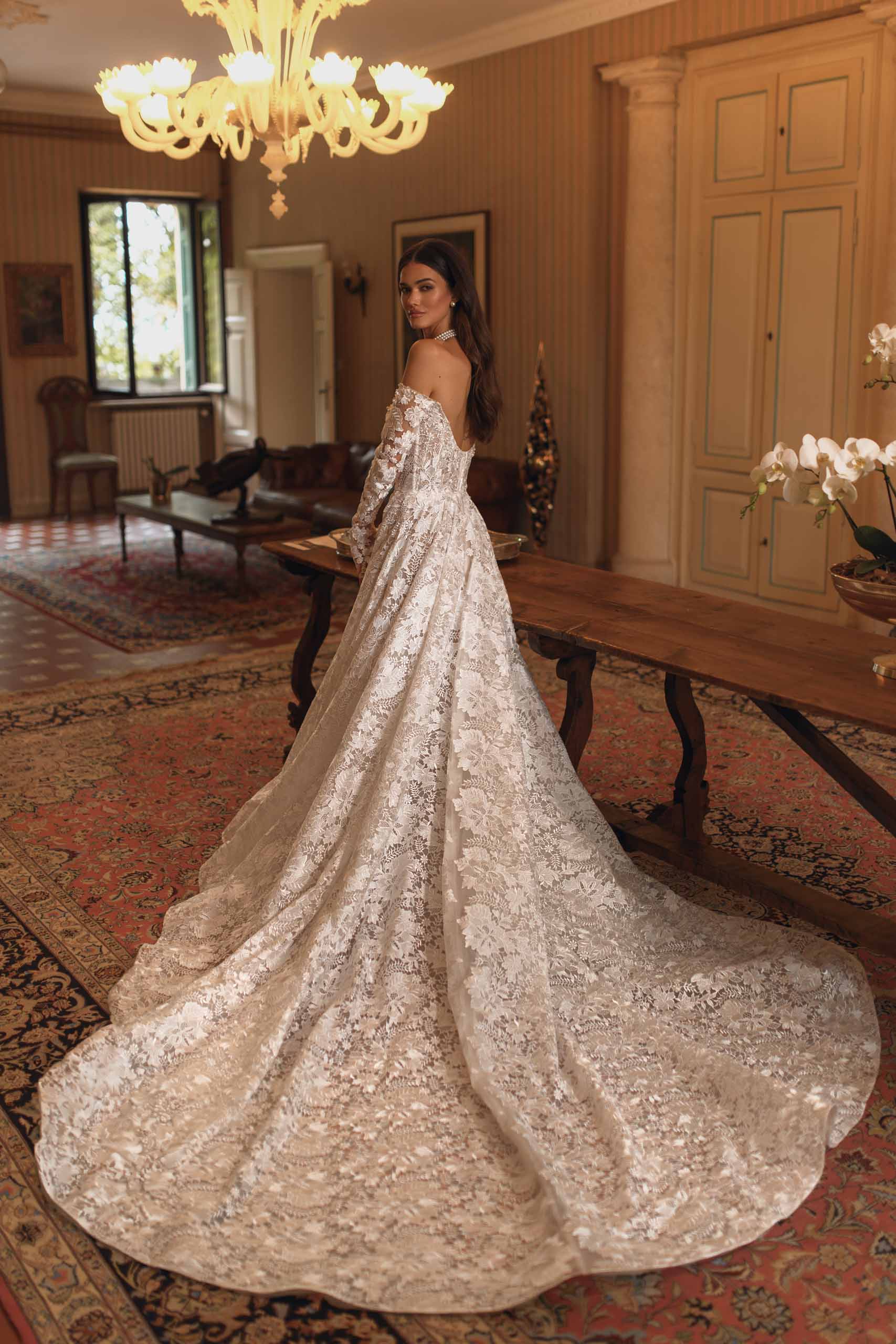 Discover the enchanting elegance of our Amira Gown, inspired by modern fairytales. Crafted with luxurious lace, this ballgown highlights your beauty and brings a touch of timeless grace to any special occasion. Make a statement with this stunning gown.