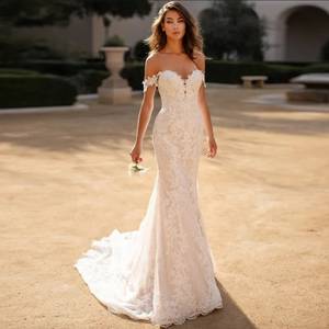 Indulge in luxury and sophistication with our Robe Raine. This elegant off-the-shoulder lace mermaid wedding dress boasts a sweetheart neckline and a sweeping train. Perfect for the discerning bride who wants to make a statement on her special day. Made for women who appreciate timeless beauty and exquisite craftsmanship.