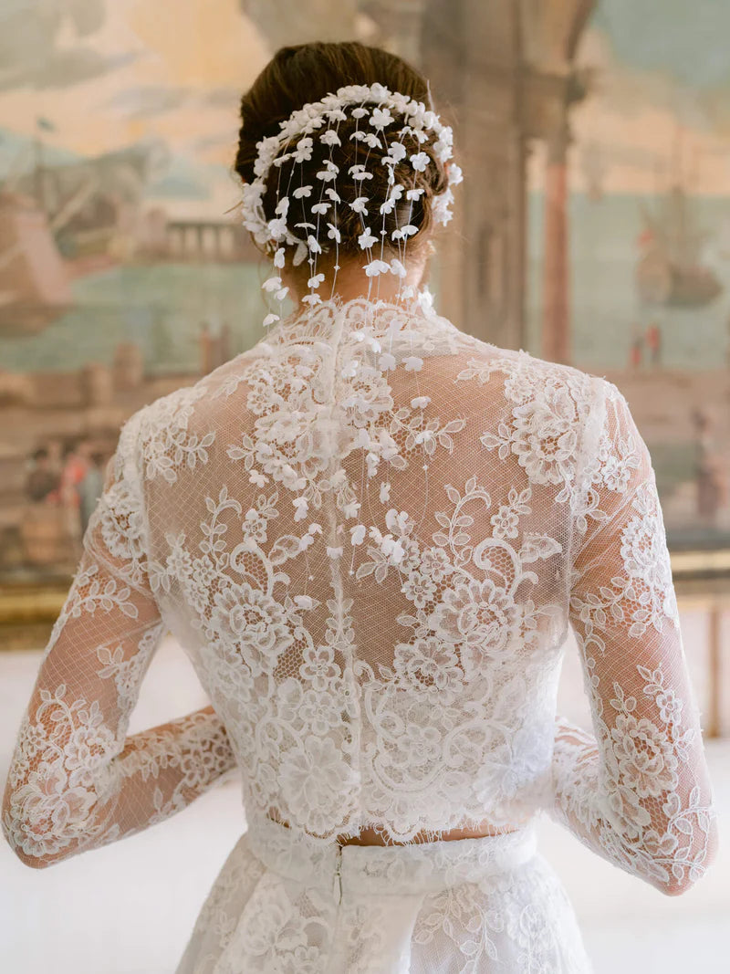 Experience the opulent Melrose Gown, a stunning garment crafted from premium lace and mesh. Its lace details and form-fitting bodice create a striking silhouette, while the voluminous skirt offers versatility for elegant and refined ensembles. In elegant ivory, this minimalistic design epitomizes exclusivity and sophistication.