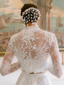 Experience the opulent Melrose Gown, a stunning garment crafted from premium lace and mesh. Its lace details and form-fitting bodice create a striking silhouette, while the voluminous skirt offers versatility for elegant and refined ensembles. In elegant ivory, this minimalistic design epitomizes exclusivity and sophistication.