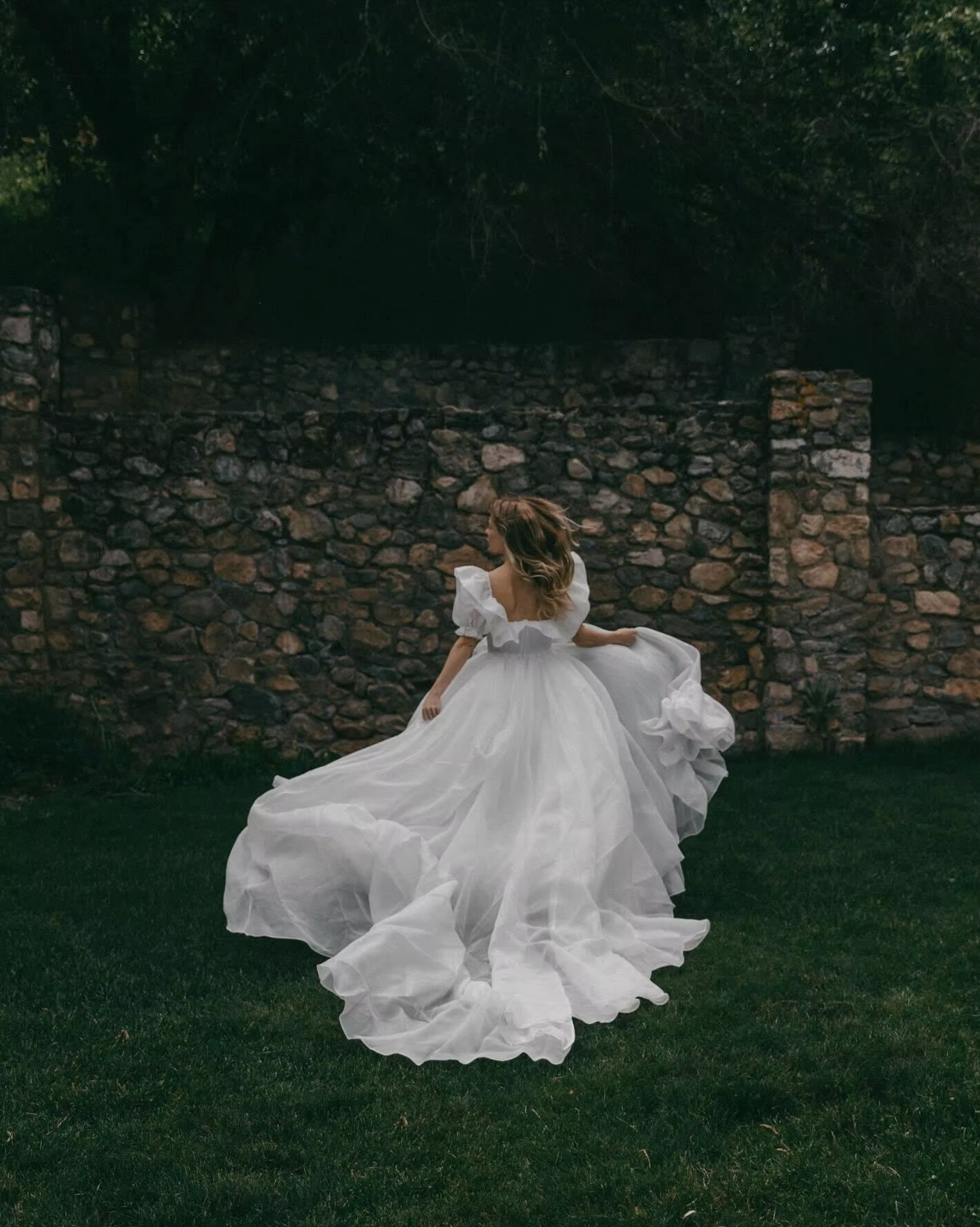 The Danielle Dress is everything you could dream of in a fantasy bridal gown. Enchanting, chic, and romantic, it will make you feel like a princess on your special day. The flowy design adds a touch of elegance, making it the perfect choice for a fairytale wedding. Say "I do" to the dress of your dreams.