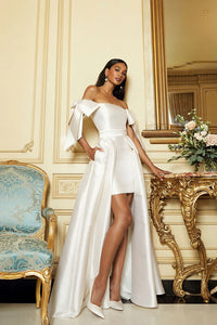 Crafted from luxurious silk and wool, the Margaret Dress offers a refined blend of texture and structure. Its innovative convertible design features a removable overskirt layered over a tailored midi pencil skirt, allowing for seamless transitions between sophisticated elegance and modern versatility. Ideal for those who appreciate expert craftsmanship and adaptable style.