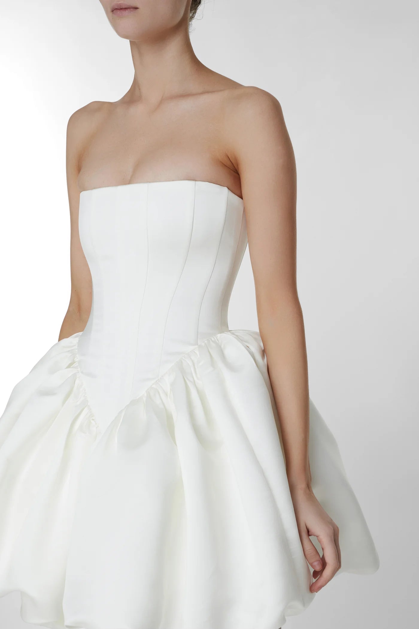 Upgrade your style with the versatile and feminine Maddison Dress. From the ceremony to the after-party, this strapless design effortlessly adapts to your desired look. Elevate your wedding attire with the perfect choice: the Eva Dress, your go-to for both beauty and functionality.