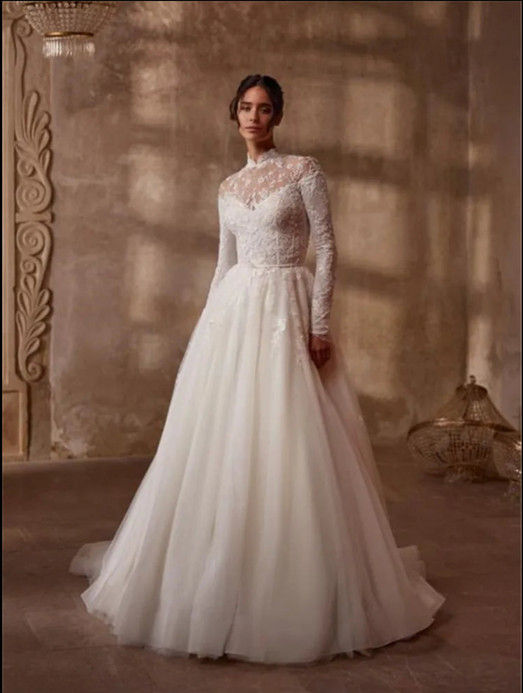Indulge in timeless elegance with the Robe Mercer. This luxurious vintage wedding dress features intricate lace detailing, a stunning ball gown silhouette, and long sleeves for a touch of grace and sophistication. Perfect for the bride seeking a romantic and classic look on her special day.