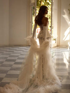 Experience the regal elegance and timeless grace of the Joely Gown. Featuring a flattering sweet-heart neckline and hidden boning, this gown creates a structured fit that elongates the silhouette and defines the waist. The lace-up back closure adds a touch of luxury, while the matching skirt completes the bridal look.