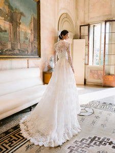 Experience the opulent Melrose Gown, a stunning garment crafted from premium lace and mesh. Its lace details and form-fitting bodice create a striking silhouette, while the voluminous skirt offers versatility for elegant and refined ensembles. In elegant ivory, this minimalistic design epitomizes exclusivity and sophistication.