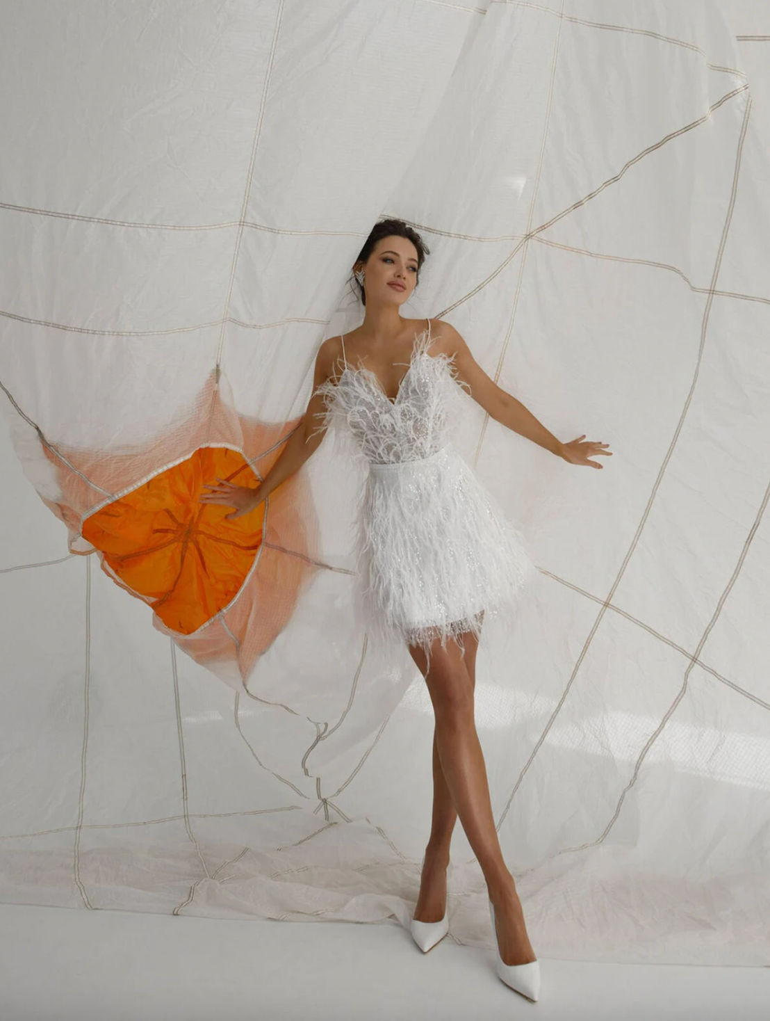 Get ready to shine and turn heads in our Charlita Dress! This stunning robe de soirée features a backless design with eye-catching sequins and delicate feather accents. The sweetheart neckline and spaghetti straps add a touch of elegance, making it the perfect choice for any formal event. Show off your unique style and make a statement with the Charlita Dress!