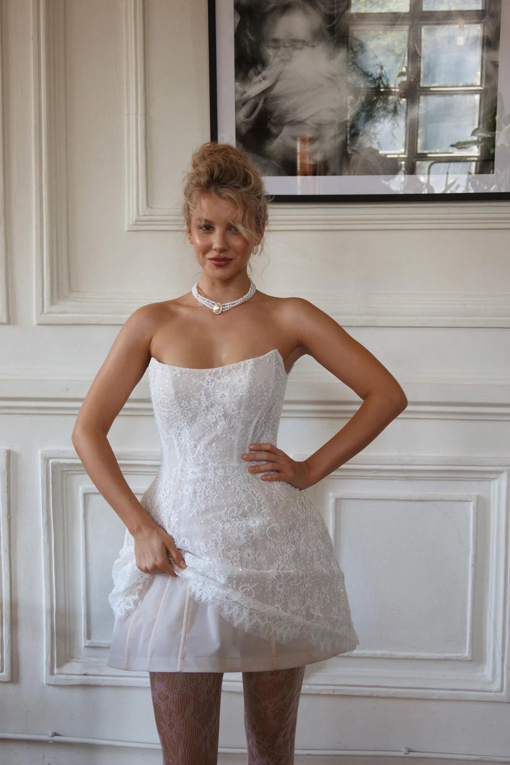 Experience the perfect combination of elegance and contemporary style with our Cameia Mini Dress. Featuring detachable sleeves and intricate lace details, this short wedding dress will make you feel like a princess. The corset back and zipper closure ensure a flawless fit, while the delicate lace adds a touch of romance.