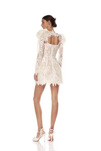 Elevate your bridal look with the Colette Lace Mini Dress. The sweetheart neckline and butterfly embellishments exude feminine grace, while the boned bodice and structured skirt provide a flattering silhouette. The hidden adjustable straps ensure a comfortable fit, making this dress perfect for your special day.