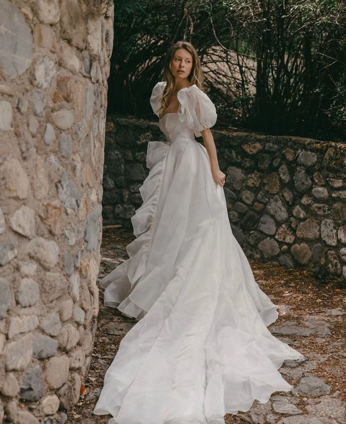 The Danielle Dress is everything you could dream of in a fantasy bridal gown. Enchanting, chic, and romantic, it will make you feel like a princess on your special day. The flowy design adds a touch of elegance, making it the perfect choice for a fairytale wedding. Say "I do" to the dress of your dreams.