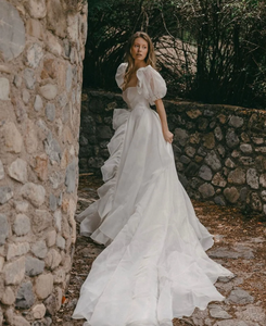 The Danielle Dress is everything you could dream of in a fantasy bridal gown. Enchanting, chic, and romantic, it will make you feel like a princess on your special day. The flowy design adds a touch of elegance, making it the perfect choice for a fairytale wedding. Say "I do" to the dress of your dreams.