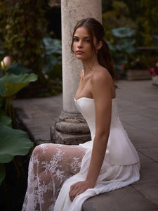 Indulge in the luxurious elegance of the Fiorella Dress. With a stunning satin sweet-heart design, this dress perfectly contours your figure, while structured boning offers support and a refined lace-up back creates a sharp, defined silhouette. It's the perfect piece for radiating timeless sophistication.