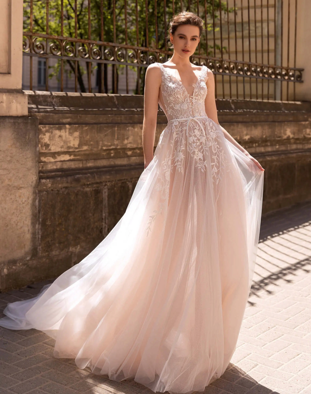 Elevate your wedding day look with our exquisite Robe Lumière. Delicate lace and a flattering A line cut come together in this Abito Da Sposa, ensuring a graceful silhouette. Let the romance of a long lace wedding dress add a touch of luxury to your special day.