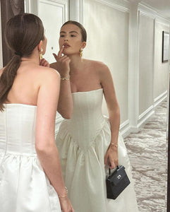 Upgrade your style with the versatile and feminine Maddison Dress. From the ceremony to the after-party, this strapless design effortlessly adapts to your desired look. Elevate your wedding attire with the perfect choice: the Eva Dress, your go-to for both beauty and functionality.