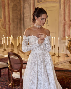 Elevate your style with the Robe Chantilly. This Adel lace dress enhances your figure and exudes sophistication. The delicate neckline adds a subtle highlight to your décolletage, making you feel confident and elegant. Perfect for any occasion, this dress is a must-have for your wardrobe.