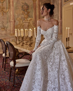 Elevate your style with the Robe Chantilly. This Adel lace dress enhances your figure and exudes sophistication. The delicate neckline adds a subtle highlight to your décolletage, making you feel confident and elegant. Perfect for any occasion, this dress is a must-have for your wardrobe.