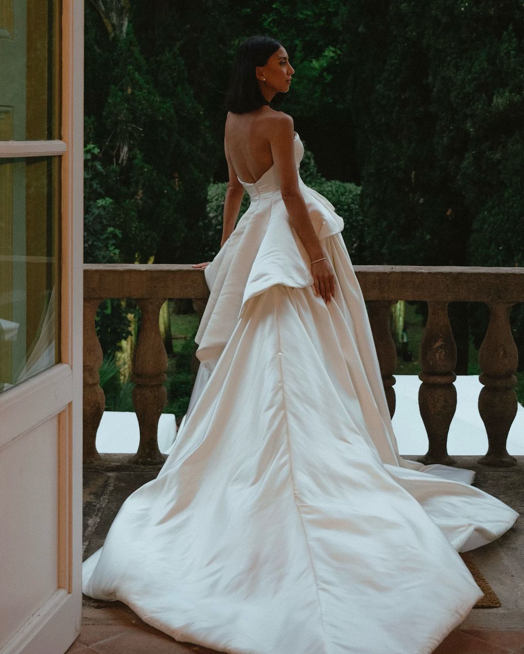 Get ready to walk down the aisle in style with our Romina Gown! This vintage-inspired wedding dress features a stunning backless design, elegant puff sleeves, and a flattering A-line silhouette. Made with soft, stain-resistant fabric, it's the perfect choice for your big day.