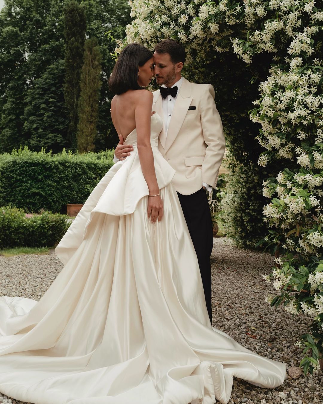 Get ready to walk down the aisle in style with our Romina Gown! This vintage-inspired wedding dress features a stunning backless design, elegant puff sleeves, and a flattering A-line silhouette. Made with soft, stain-resistant fabric, it's the perfect choice for your big day.