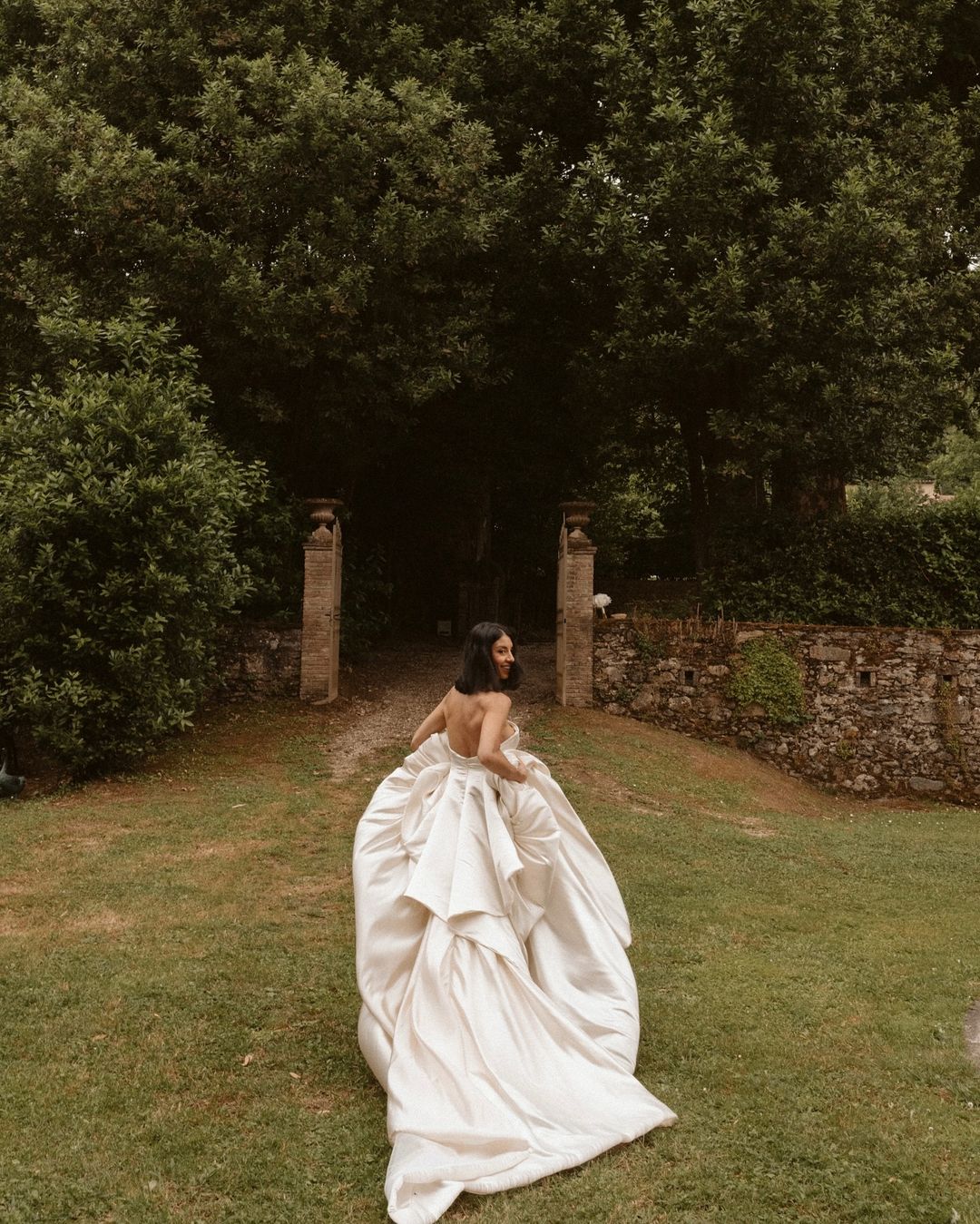 Get ready to walk down the aisle in style with our Romina Gown! This vintage-inspired wedding dress features a stunning backless design, elegant puff sleeves, and a flattering A-line silhouette. Made with soft, stain-resistant fabric, it's the perfect choice for your big day.