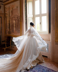 Discover the ultimate bridal elegance with our Bianca Gown! This exquisite princess-style gown features chic detailing and a stunning long train that will make you feel like royalty on your special day. Say "I do" in style with this elegant and timeless piece.