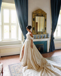 Discover the ultimate bridal elegance with our Bianca Gown! This exquisite princess-style gown features chic detailing and a stunning long train that will make you feel like royalty on your special day. Say "I do" in style with this elegant and timeless piece.