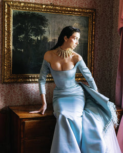 Indulge in pure elegance with the Jayne Gown. This striking piece features full-length sleeves and a delicate side train, adorned with luxurious feathers. Flawlessly tailored to accentuate your curves, this striking prom dress is an exquisite choice for any special occasion. Elevate your style to new heights with the Jayne Gown.