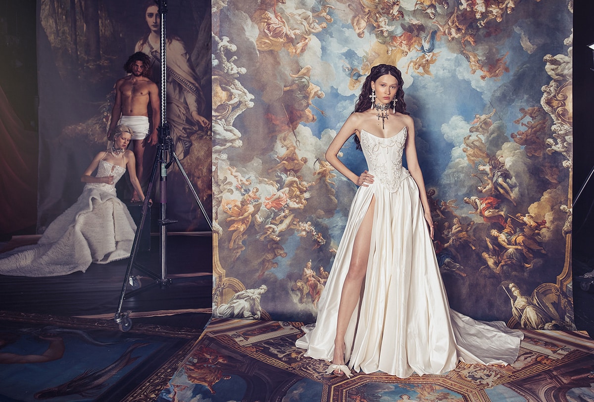 Indulge in luxury with the Isabelle Gown. Crafted with a structured corset dress, this gown features intricate Indian embroidery on the bodice and a voluminous skirt. Made from high-quality silk taffeta, it exudes elegance and sophistication, making it the perfect choice for any formal occasion. The thigh high slit adds a touch of allure to this stunning gown.