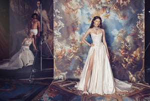 Indulge in luxury with the Isabelle Gown. Crafted with a structured corset dress, this gown features intricate Indian embroidery on the bodice and a voluminous skirt. Made from high-quality silk taffeta, it exudes elegance and sophistication, making it the perfect choice for any formal occasion. The thigh high slit adds a touch of allure to this stunning gown.