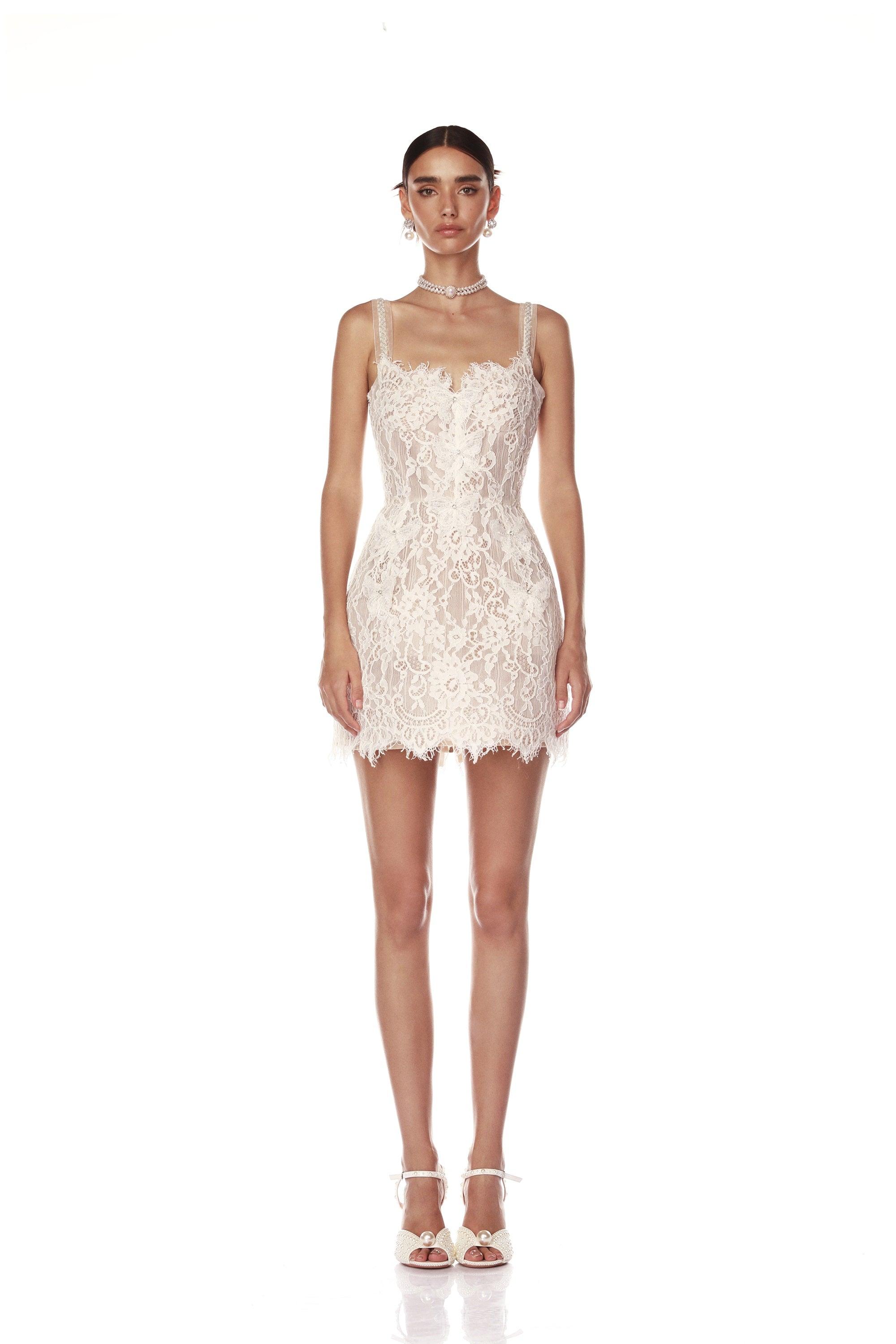 Elevate your bridal look with the Colette Lace Mini Dress. The sweetheart neckline and butterfly embellishments exude feminine grace, while the boned bodice and structured skirt provide a flattering silhouette. The hidden adjustable straps ensure a comfortable fit, making this dress perfect for your special day.
